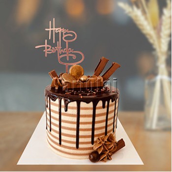 Chocolate Cake With Happy Birthday Topper 